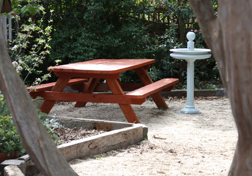picnic table in a domestic garden setting